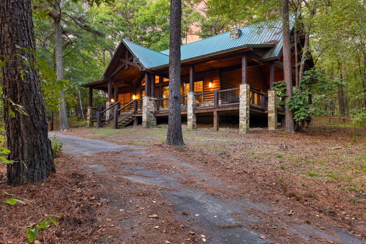 Private drive leading to your serene hideaway in the woods.