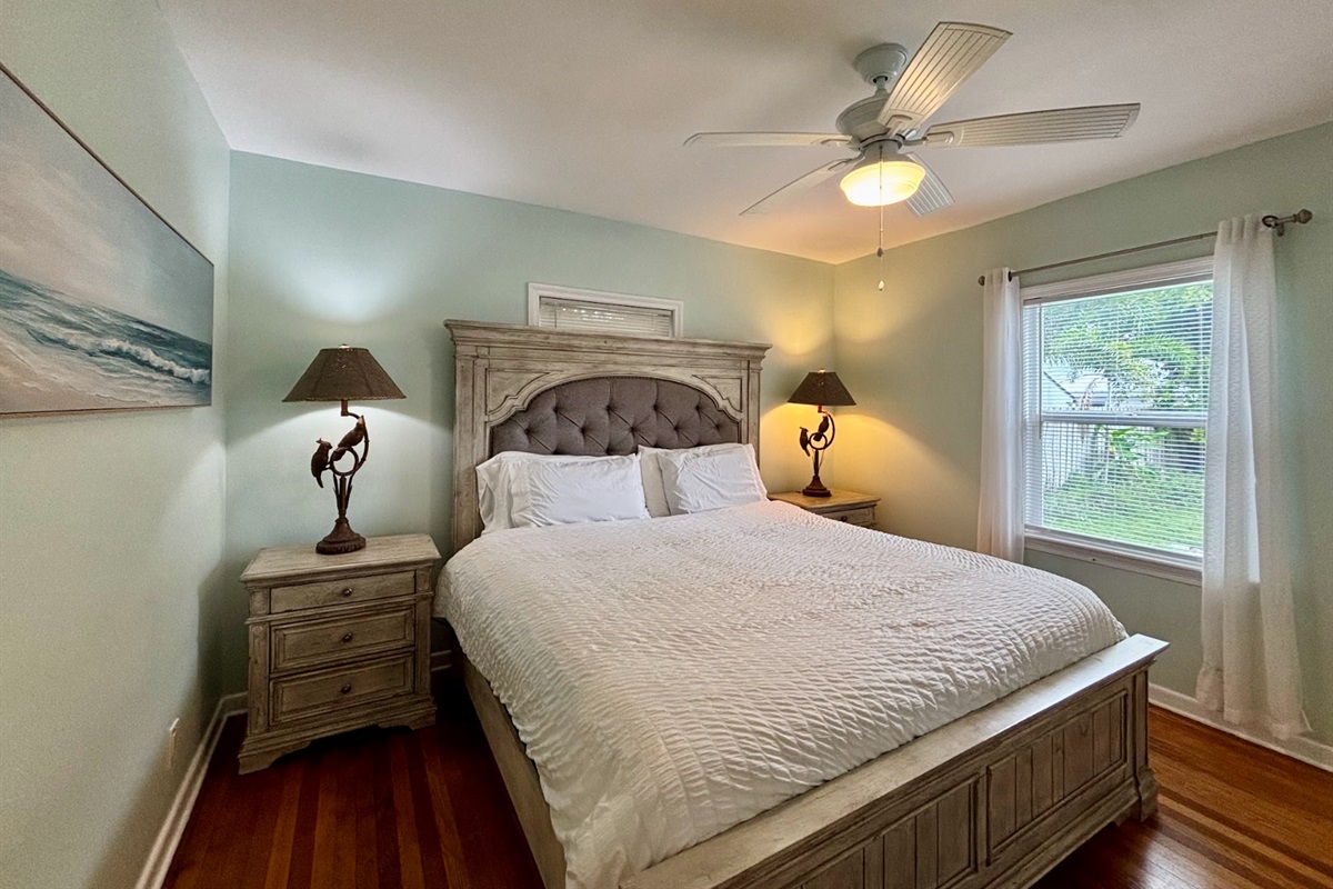 The first bedroom features a comfortable king-sized bed, facing the backyard. It also comes with an ensuite bathroom.