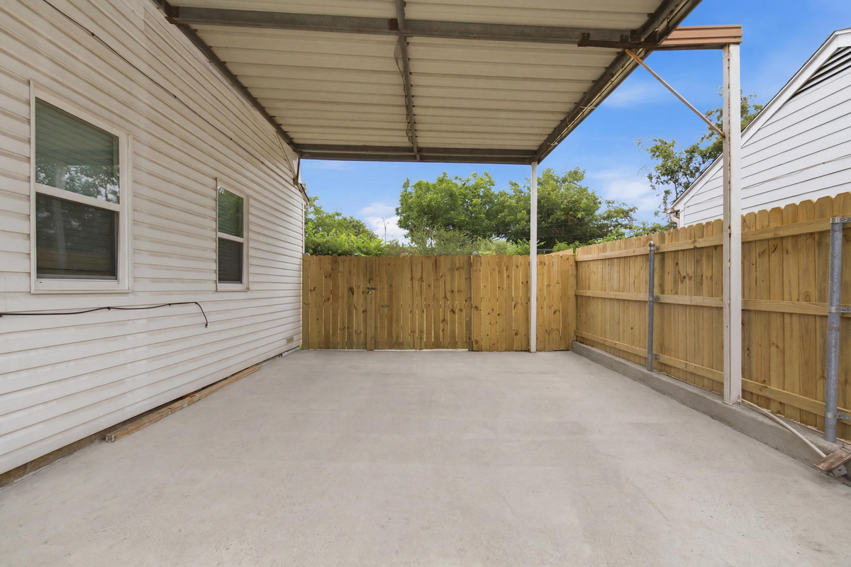 Covered Carport providing 1 protected Parking Spot, with additional Driveway Parking for up to 3 cars total. Free On-Site Parking for the whole group.
