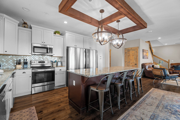 Main level kitchen. Two full-size refrigerators, two dishwashers, oven/ceramic glass cooktop, microwave, drip coffee maker, Keurig, and Nespresso. Stocked with small appliances, cookware, bakeware, utensils, dishes, glassware, mugs, and more!