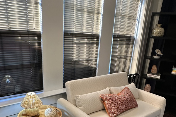 The Boho Room. Sitting area with pull out futon and lots of natural light. Smart TVs in all of our bedrooms.