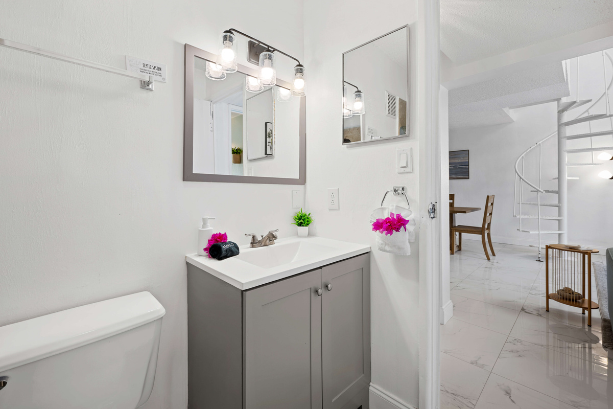 Bright, modern bathroom conveniently located just off the main living area.