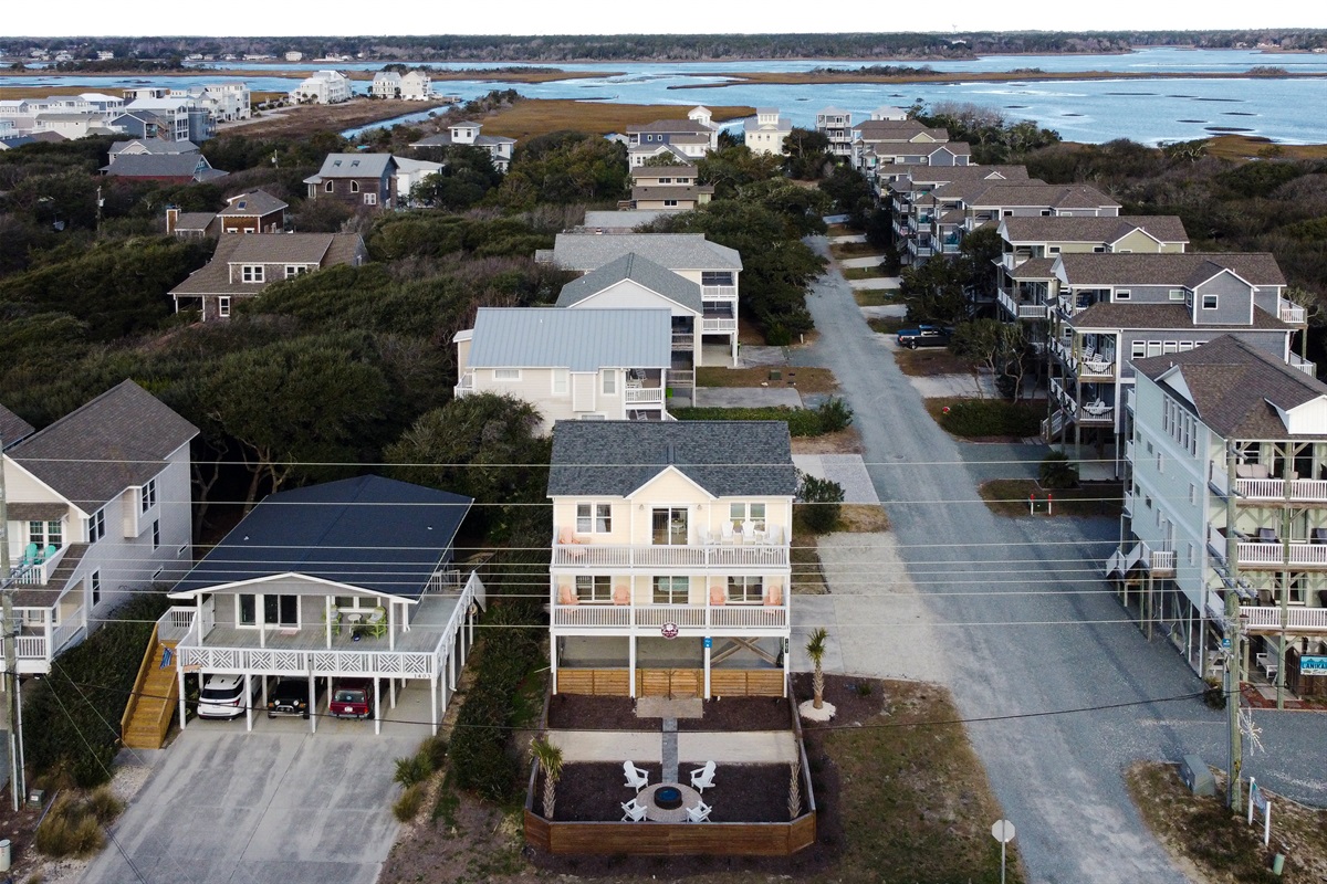 Bird&rsquo;s-eye view of the home and surrounding beach neighborhood, showing easy access to both the ocean and sound side