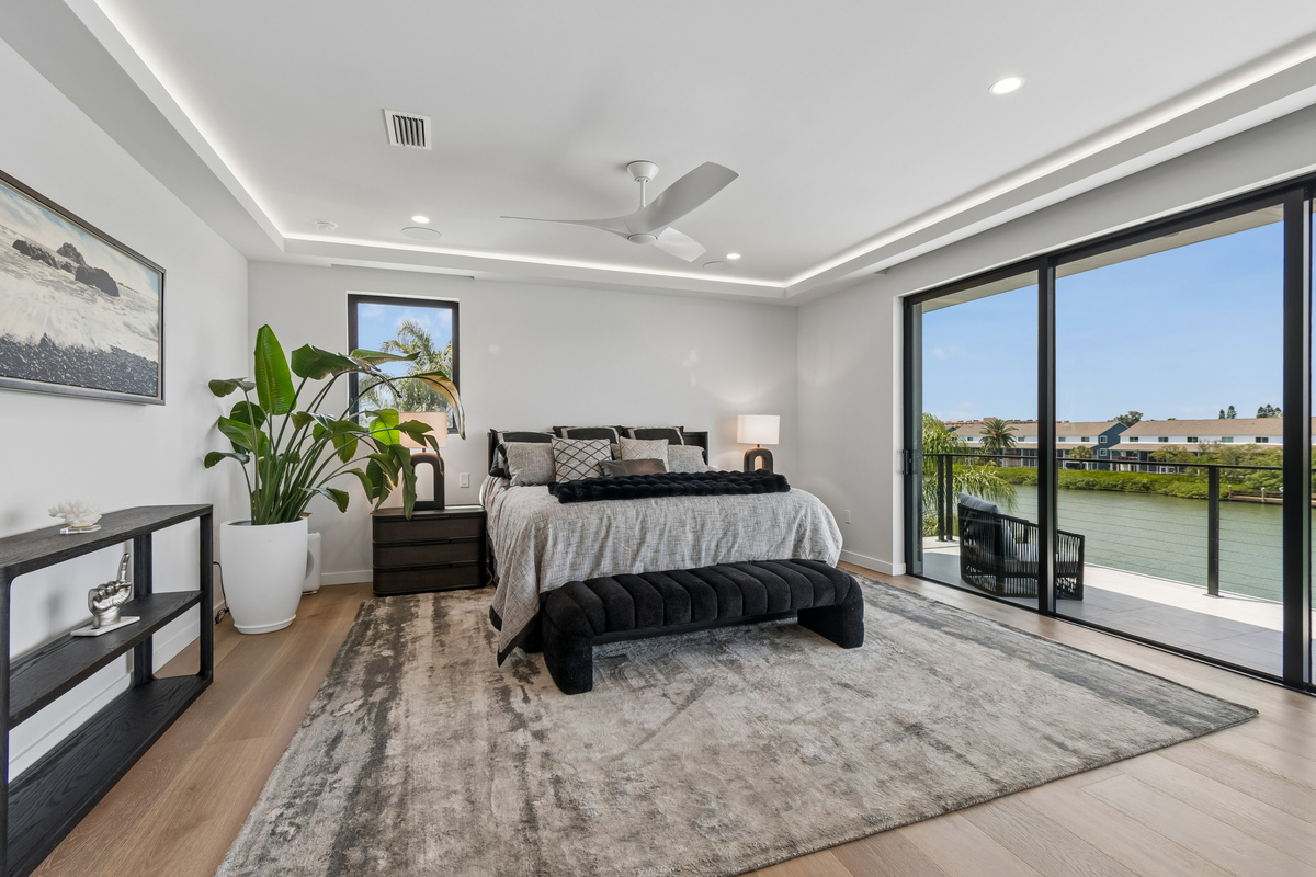 The Master bedroom features a king bed, large pocket doors and an expansive balcony for enjoying the calm of the Intracoastal