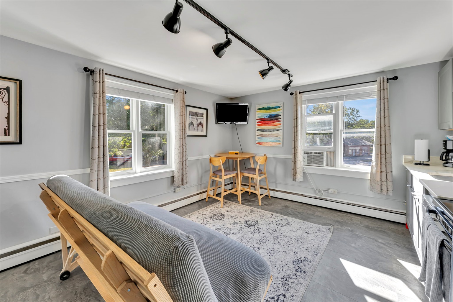 Enjoy the open layout of the living room and dining area, with smart TV.