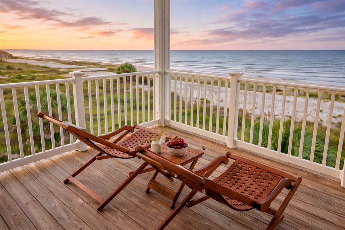 Lounge chairs and an open horizon invite slow mornings and long sunsets on the private balcony overlooking the Gulf