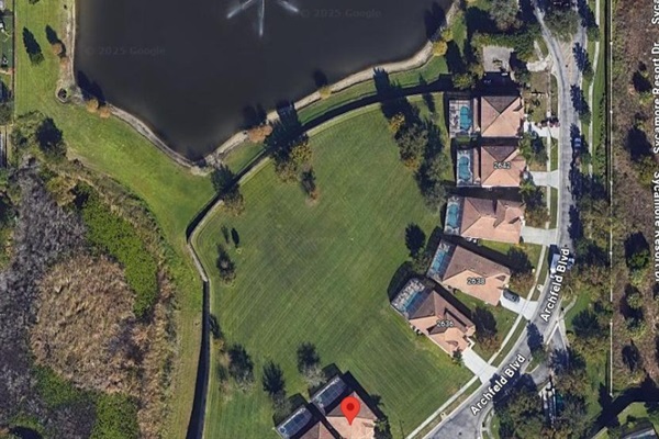 View of back yard, pond and peaceful green