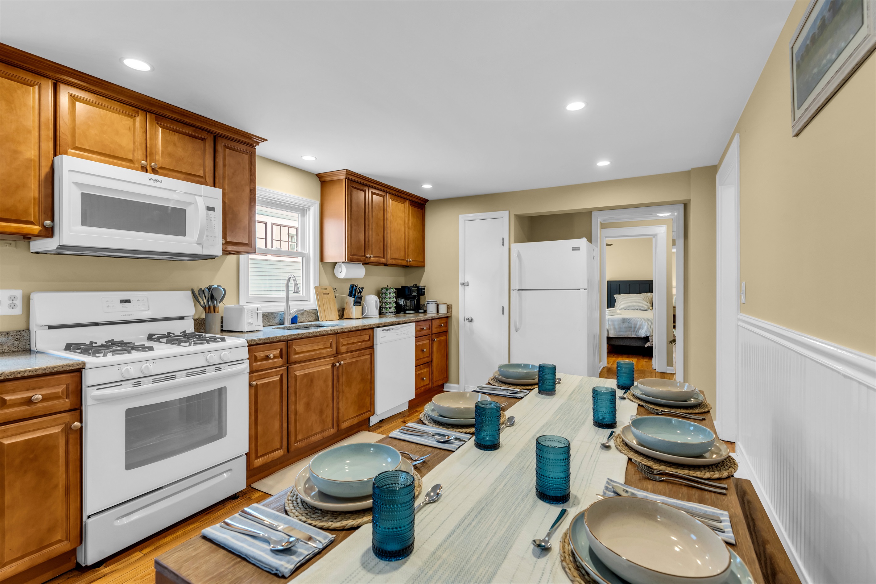 Coastal kitchen with 6 seat table with bench seating for comfort and convenience!