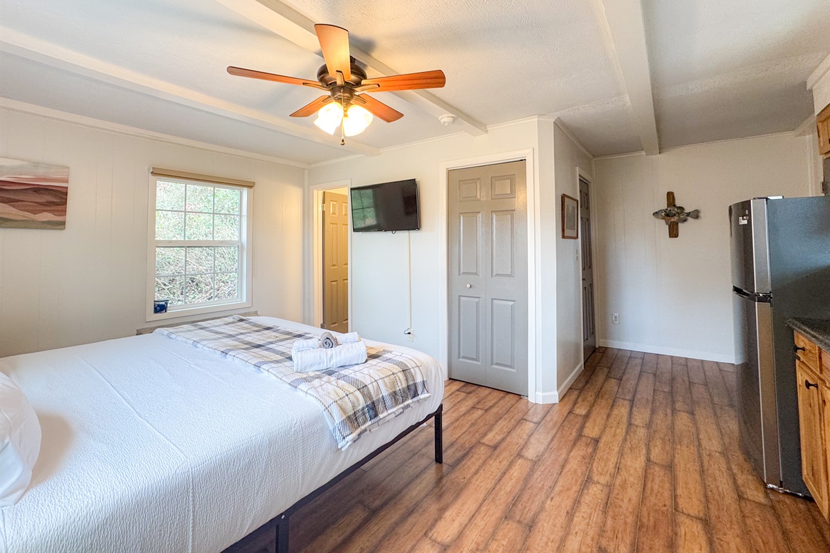The separate apartment suite features a comfy King size bed with cooling memory foam gel and high thread count bedding. There is a smart TV, a small ensuite bathroom, refrigerator, coffee maker, and some kitchen items. Mostly for drinks and such.