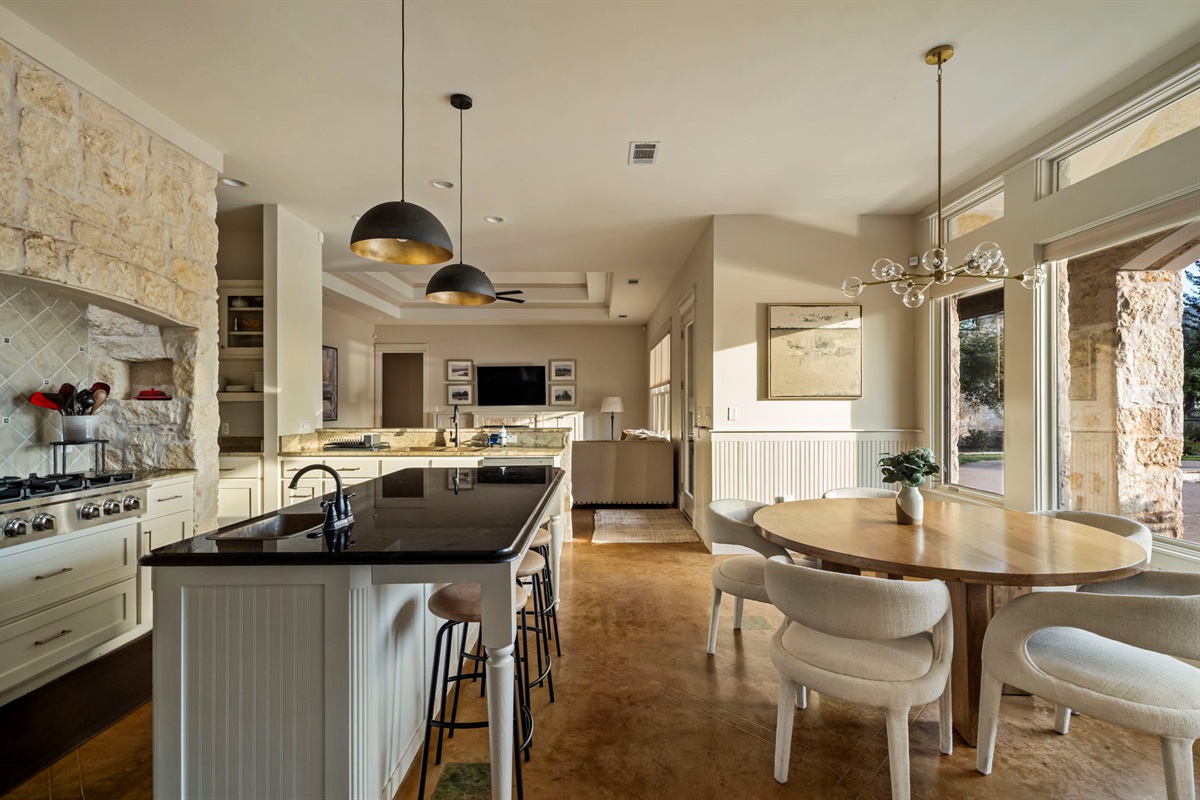 Fully stocked chef’s kitchen with island seating.
