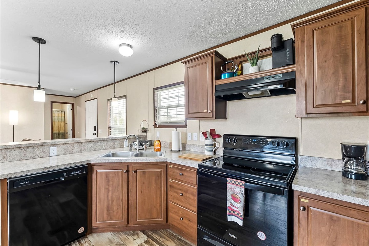 Fully equipped kitchen with modern appliances, ample counter space, and everything you need for easy home-cooked meals.