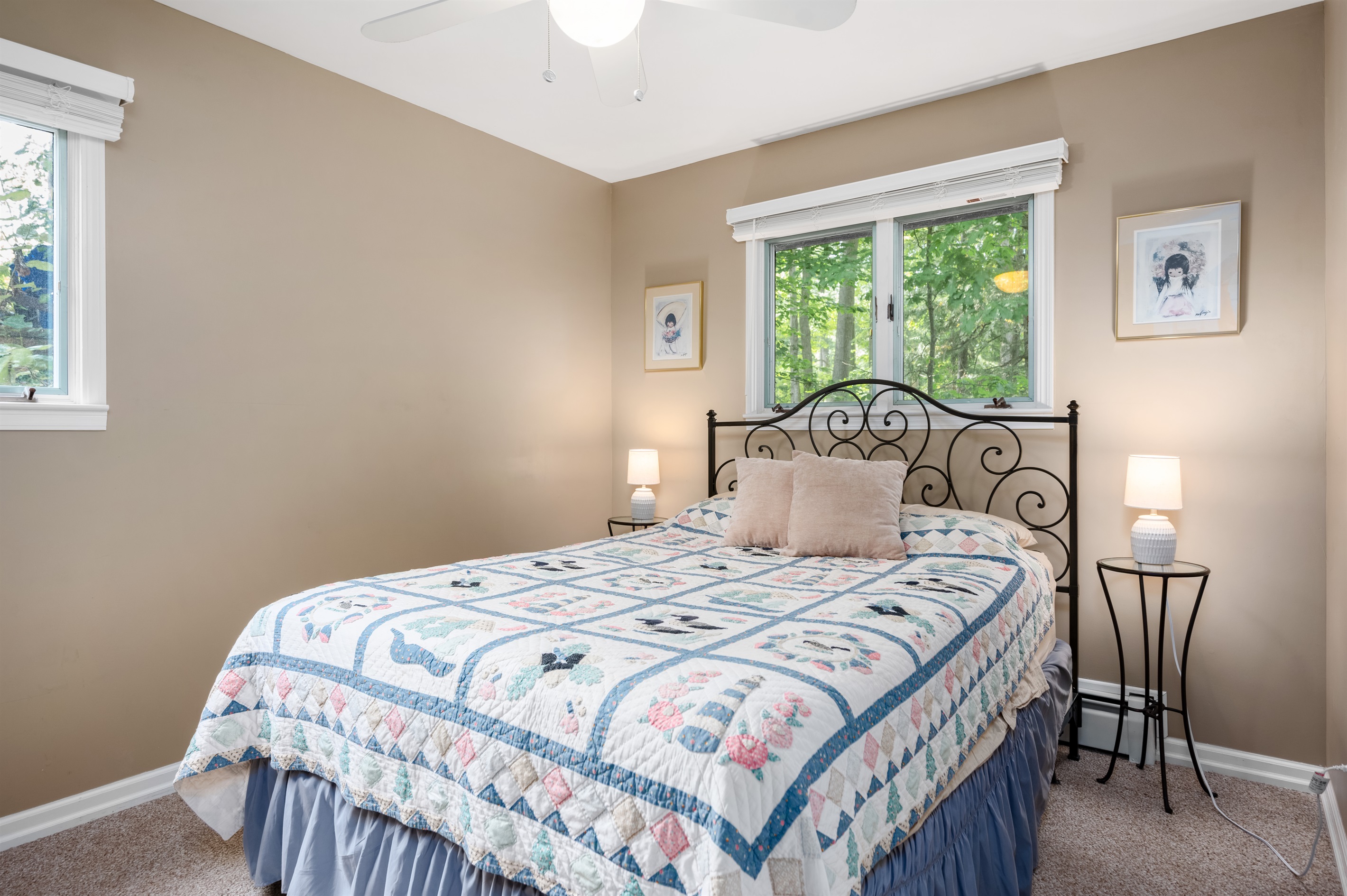 Second main level bedroom with queen bed and cozy décor