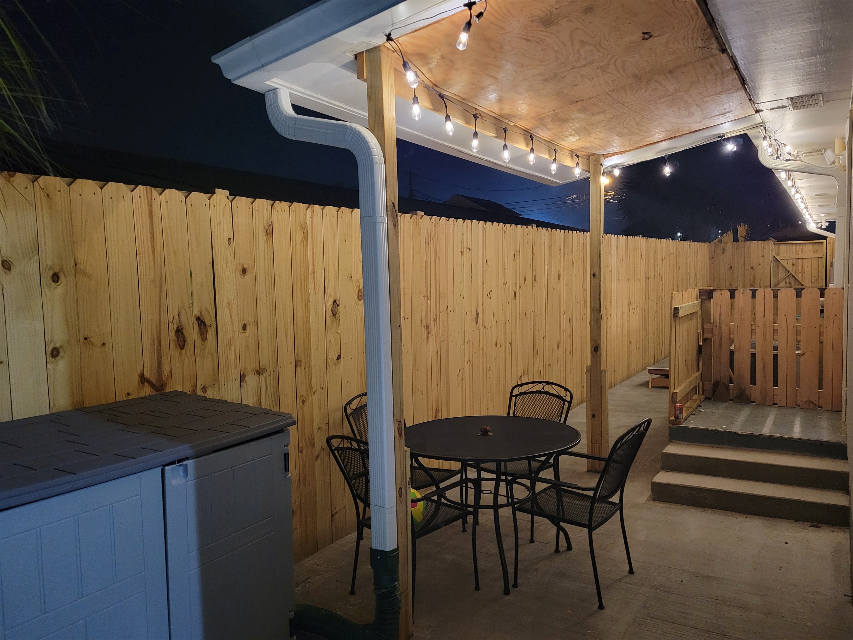 Nothing beats a night spent outside on this beautiful patio filled with patio lights, dining table, and good company. #patioVibes