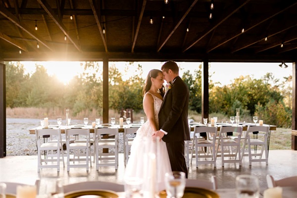 Event photo under the covered patio with scenic backdrop.