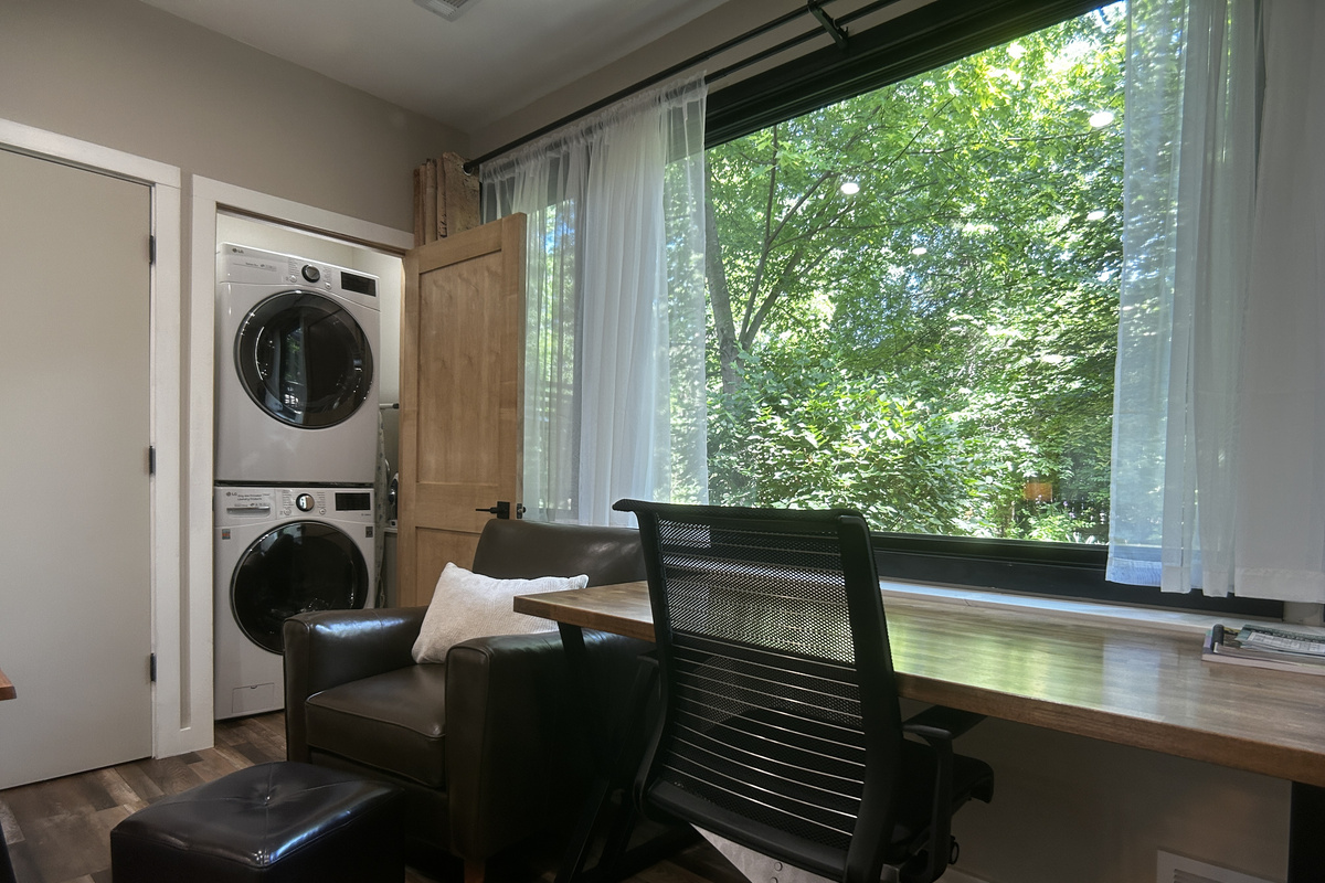 Desk with view of wildlife in backyard. The washer and dryer is in a closet.