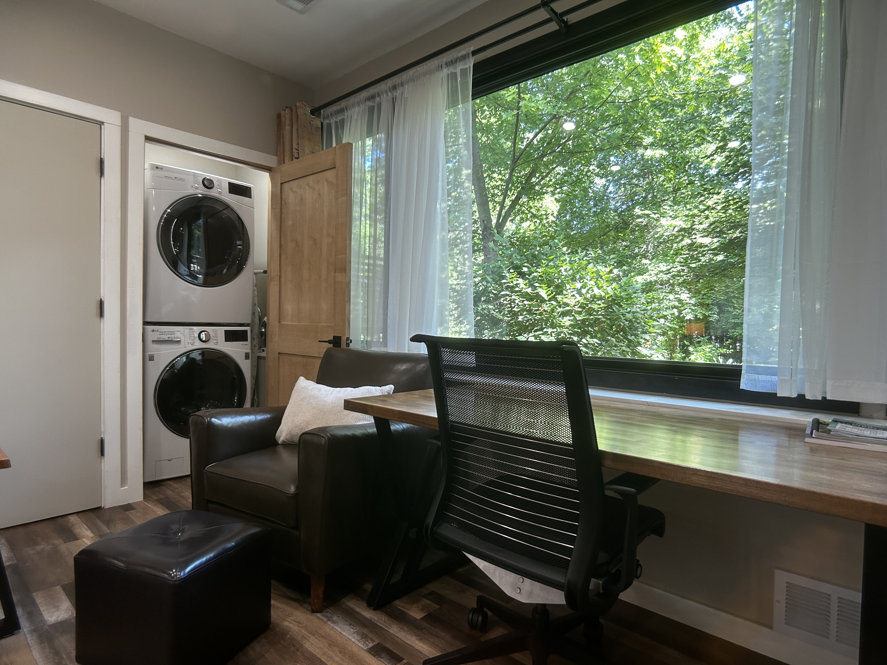 Desk with view of wildlife in backyard. The washer and dryer is in a closet.