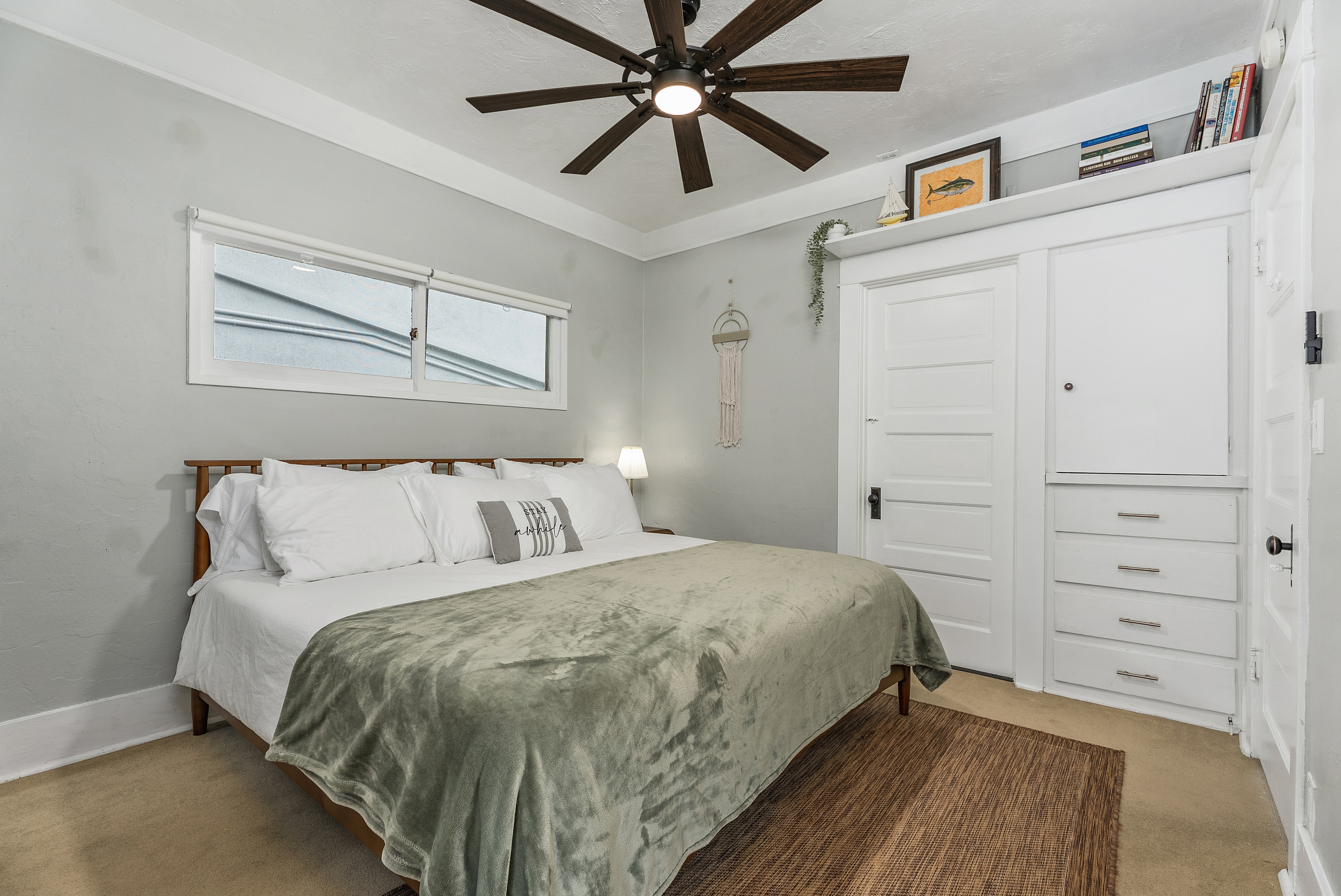 Comfortable King bed and built-in storage.