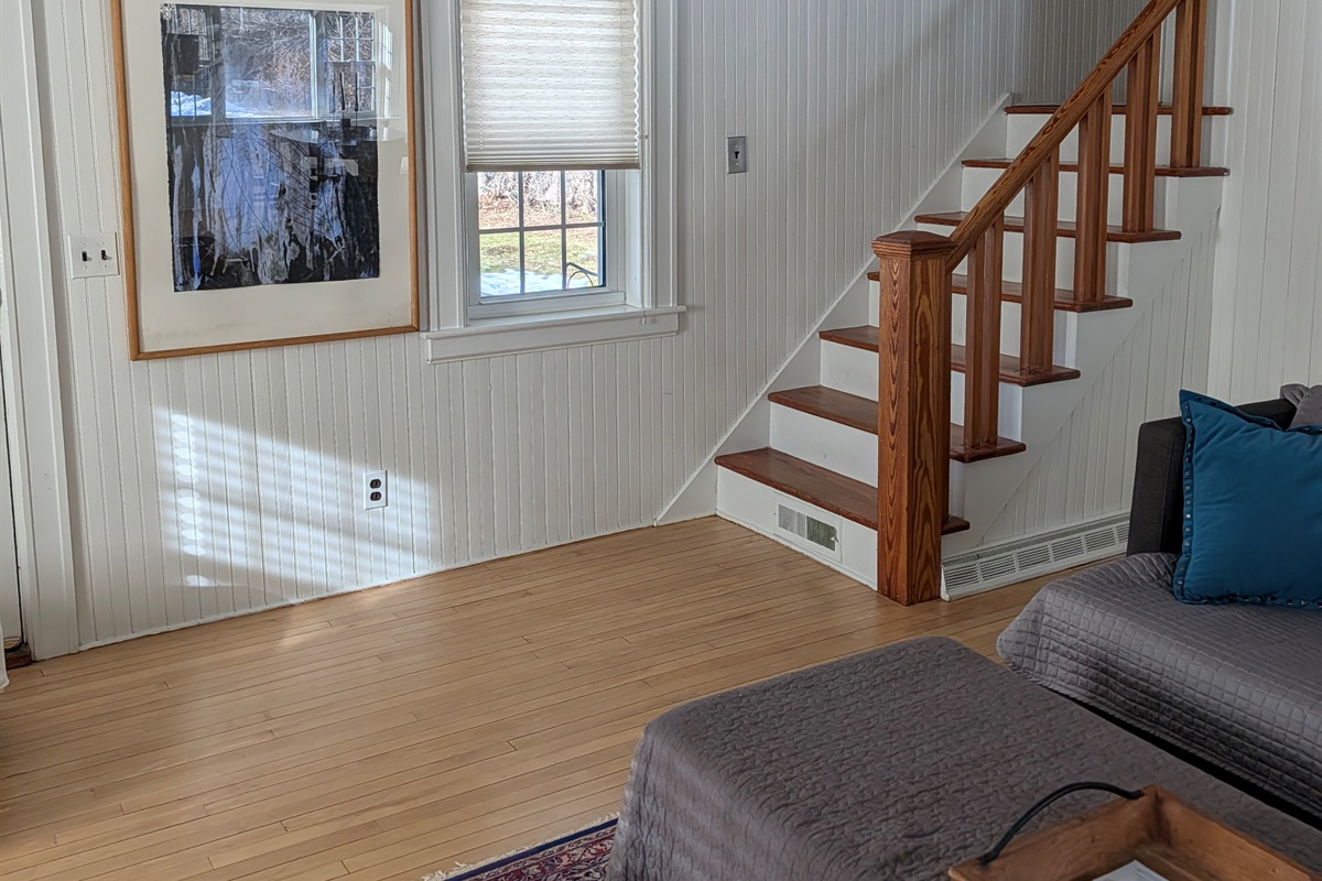 stairs up to the three bedrooms with full bathroom