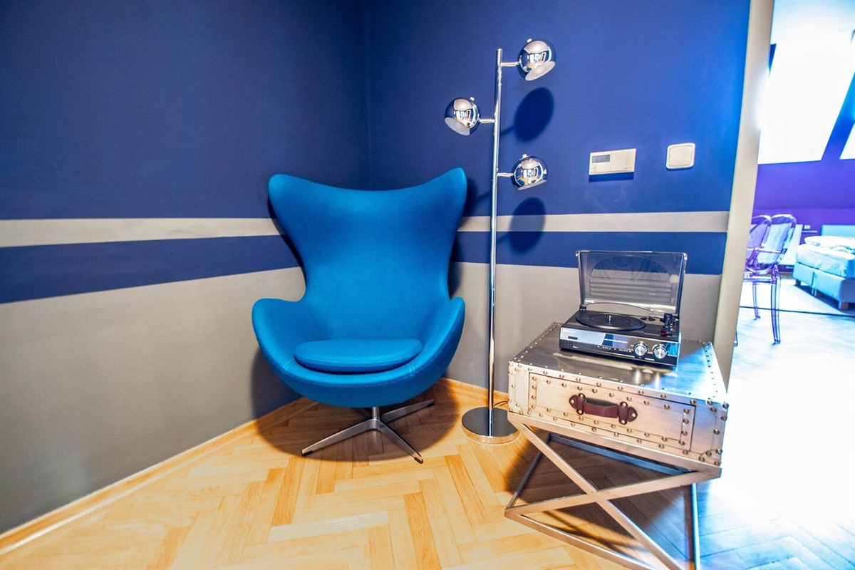 Apartment hall with a design egg-chair and gramophone.