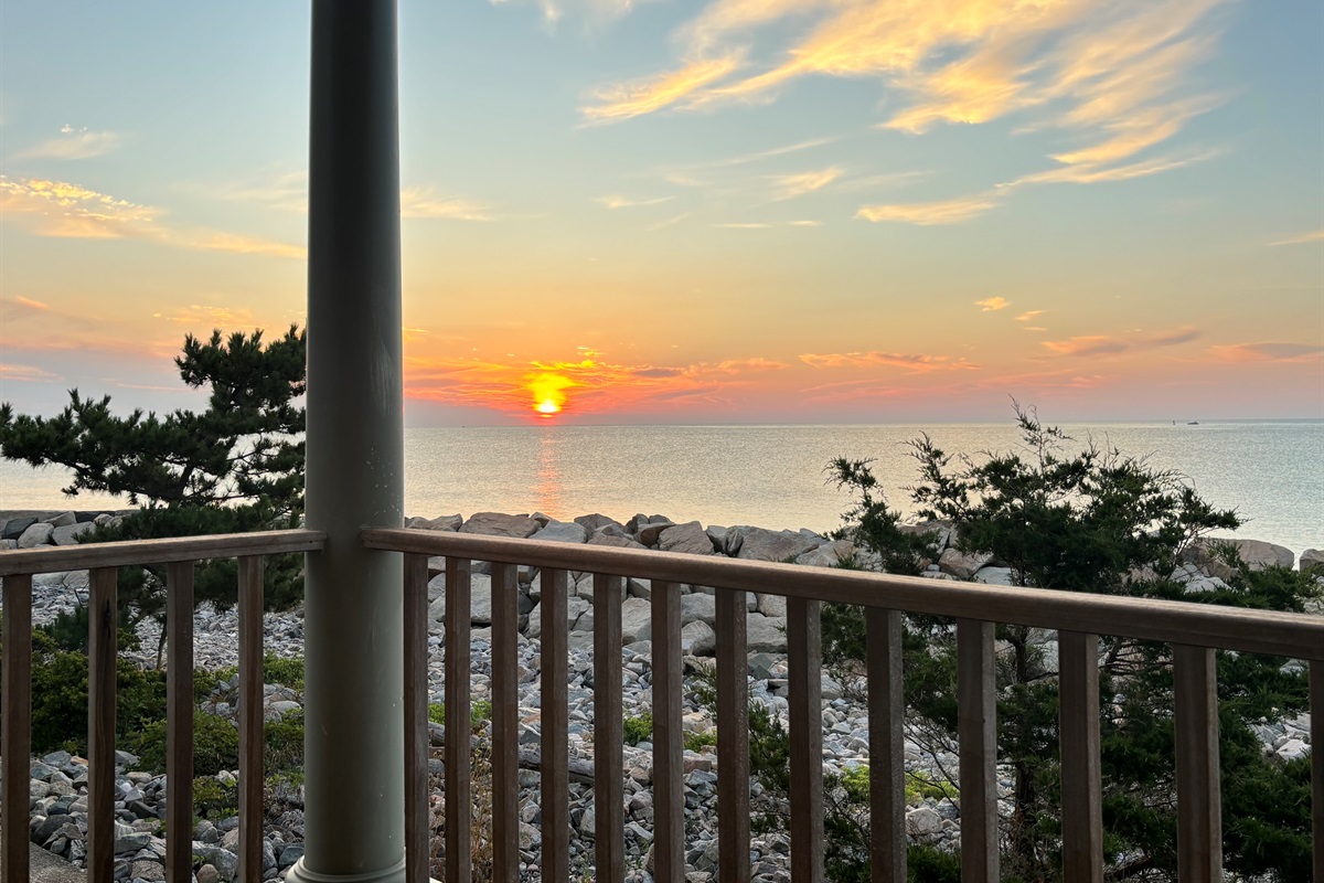 Enjoy stunning sunsets over the water right from the deck. 🌅
