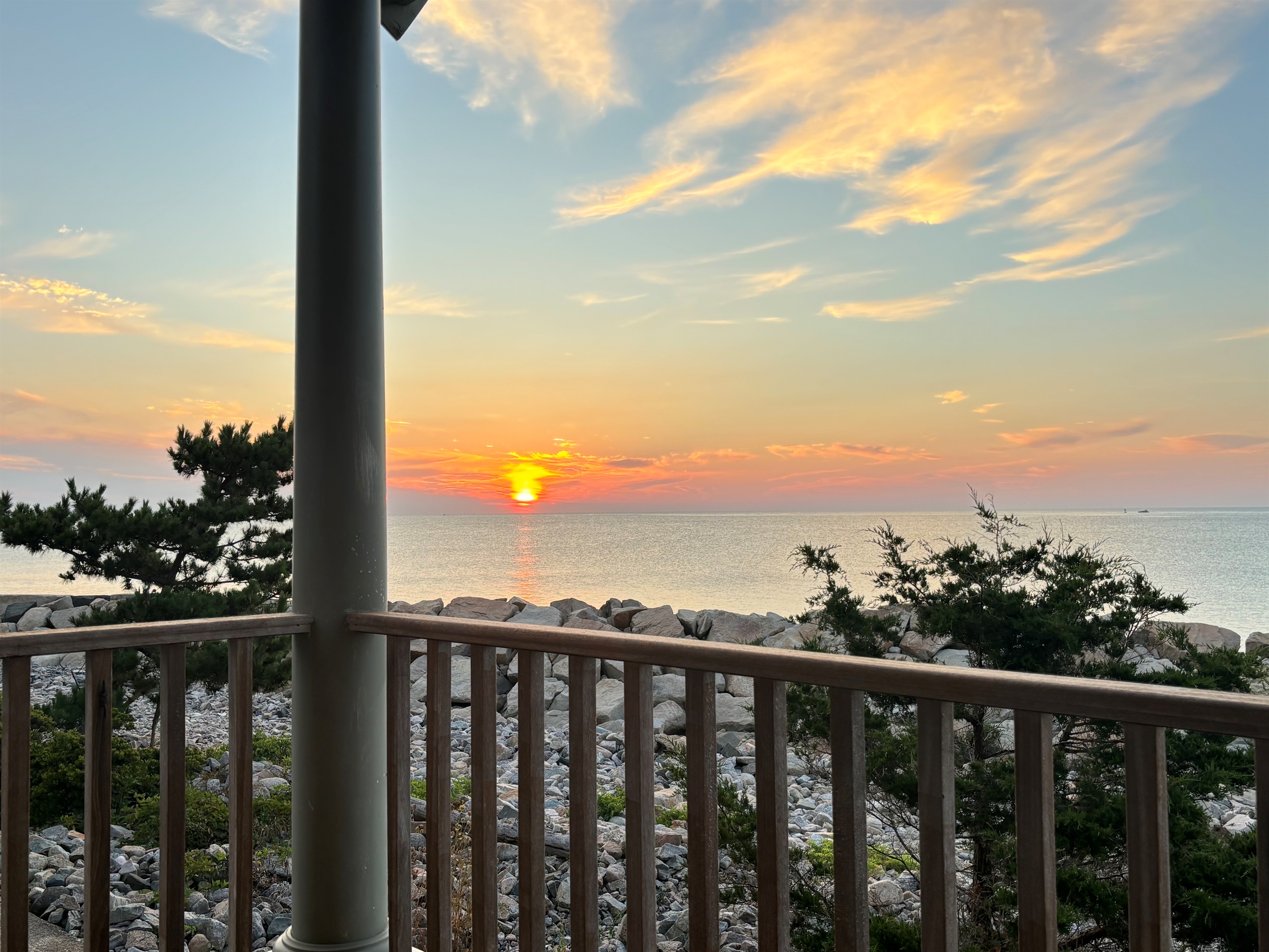 Enjoy stunning sunsets over the water right from the deck. 🌅