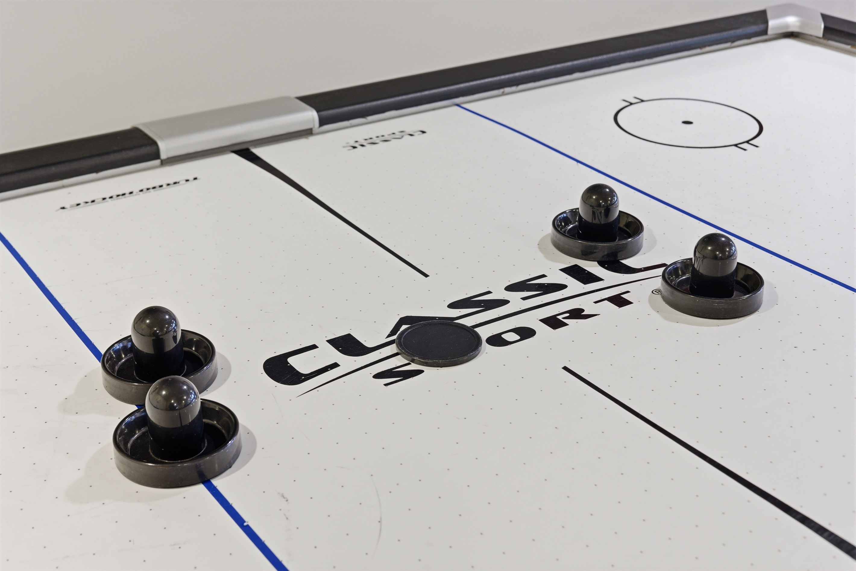 Playroom for kids and adults.  Air hockey, stereo system, toys, arcade, seating area.