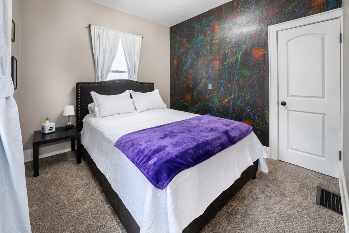 The 00's room is all about the emo music + mp3 players. This room has a queen sized bed.