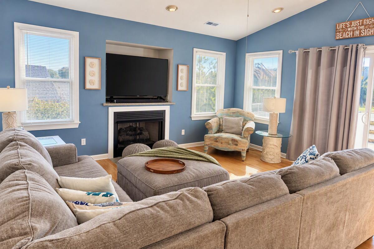 Enjoy the bright, open-concept top-floor living space, seamlessly connecting the kitchen, dining, and living areas. Step out onto the spacious deck to relax and take in the coastal breezes. Please note: the fireplace is not available for guest use.