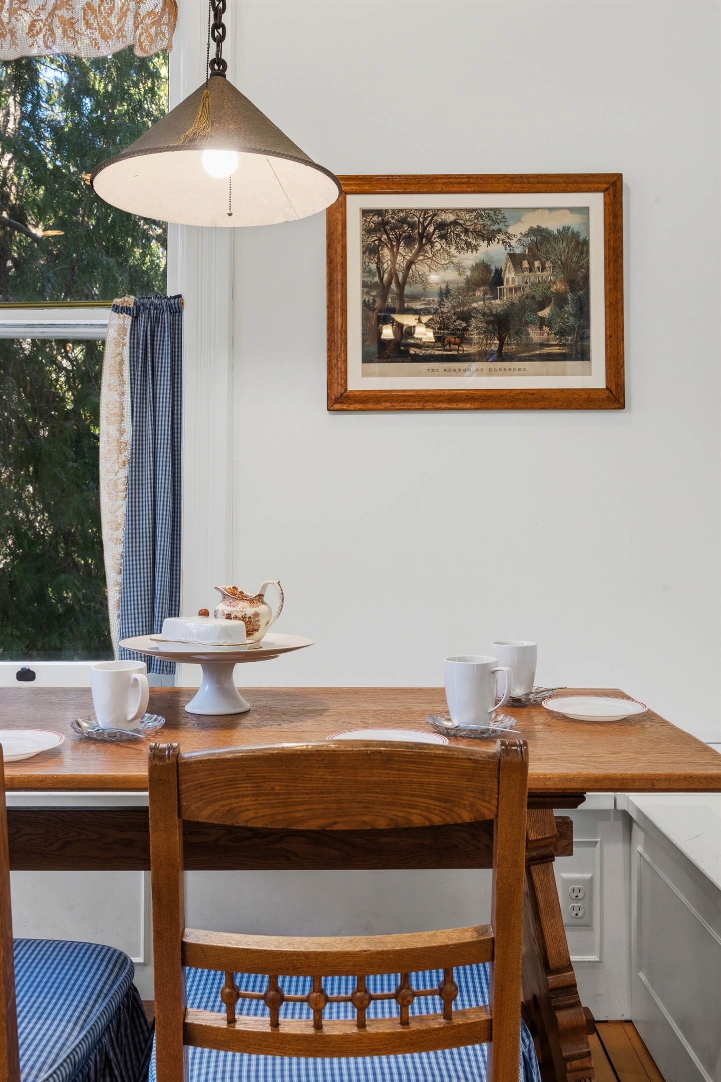 Cozy breakfast nook w/ wooden table & simple seating