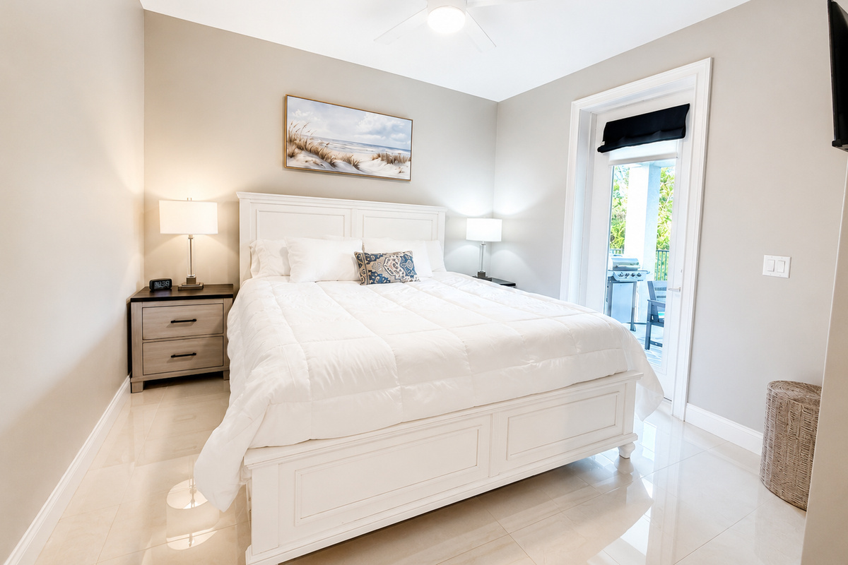 Bright, breezy, and just steps from the grill, this cheerful bedroom opens right onto the patio. Picture slippers on in the morning, coffee in hand, breakfast sizzling on the barbecue—the simple pleasures that make a family vacation feel like home.