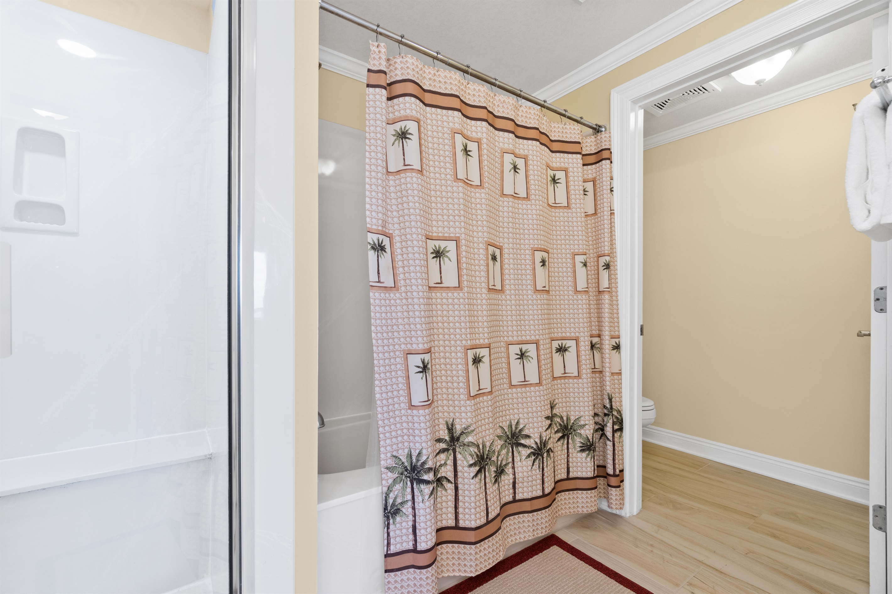 Master bathroom has stand up shower and separate tub/shower combo
