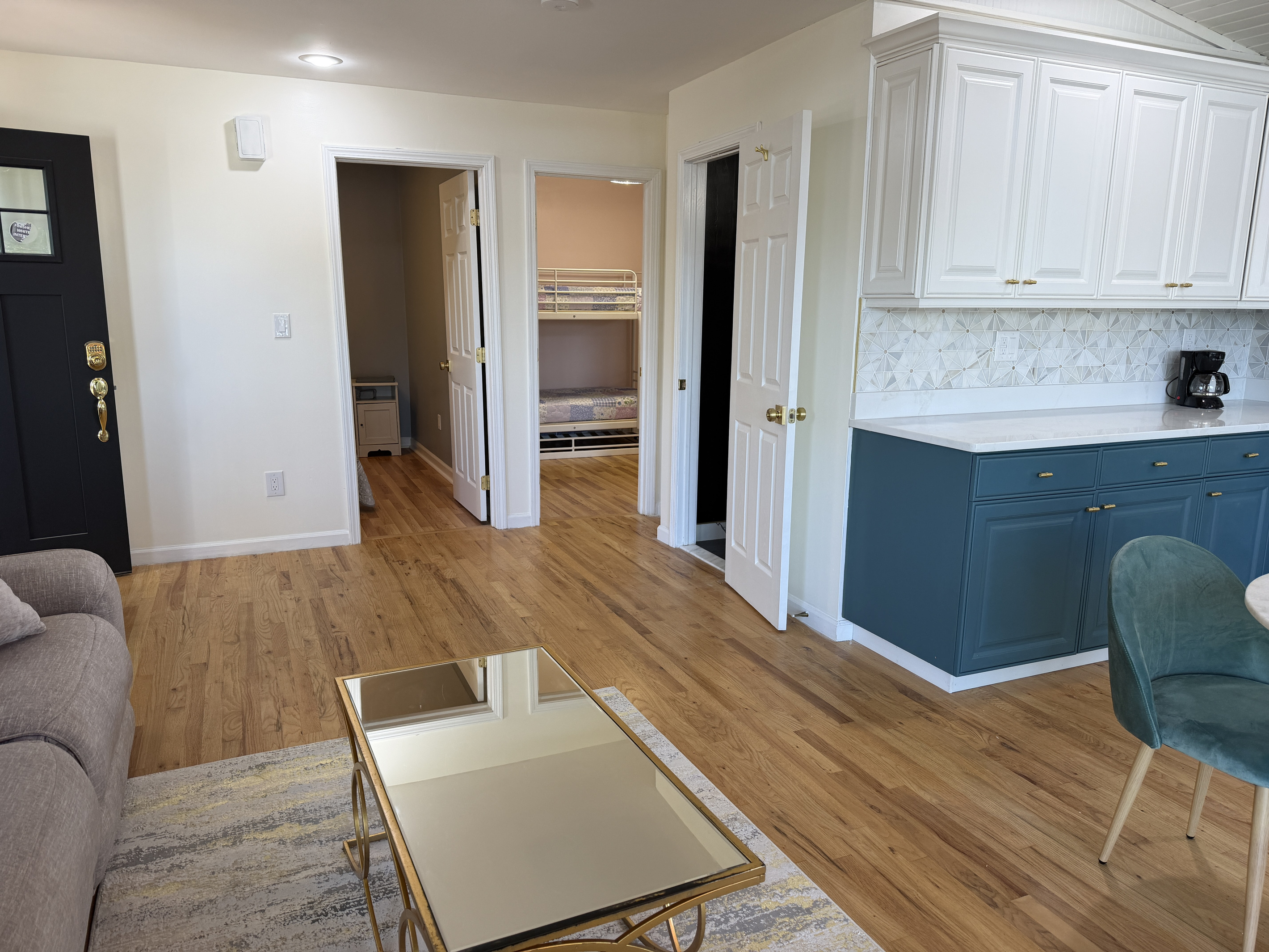 Living area with bedrooms and bathroom beyond