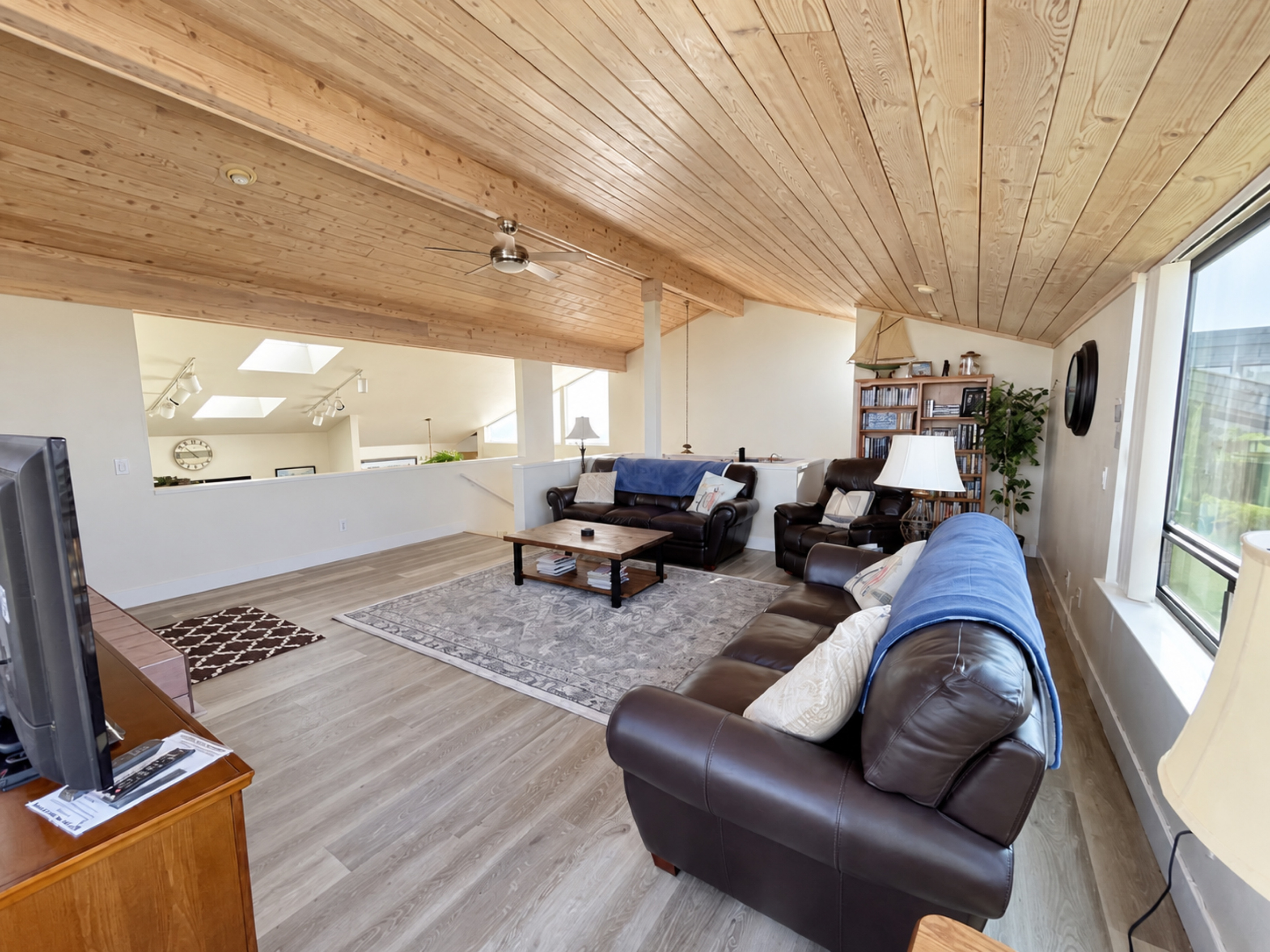 Living Room with Leather couches/chair. Large seating area.