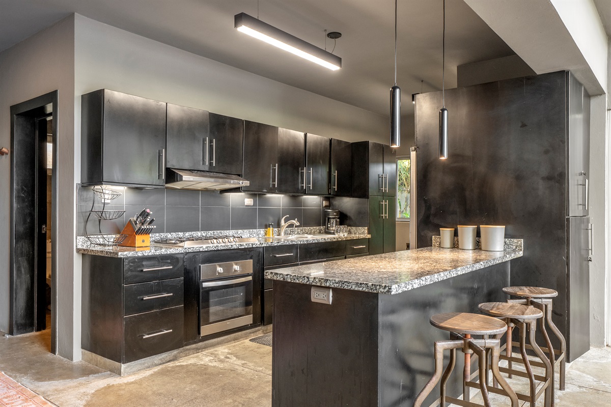 Clean, modern kitchen with appliances and cookware included.