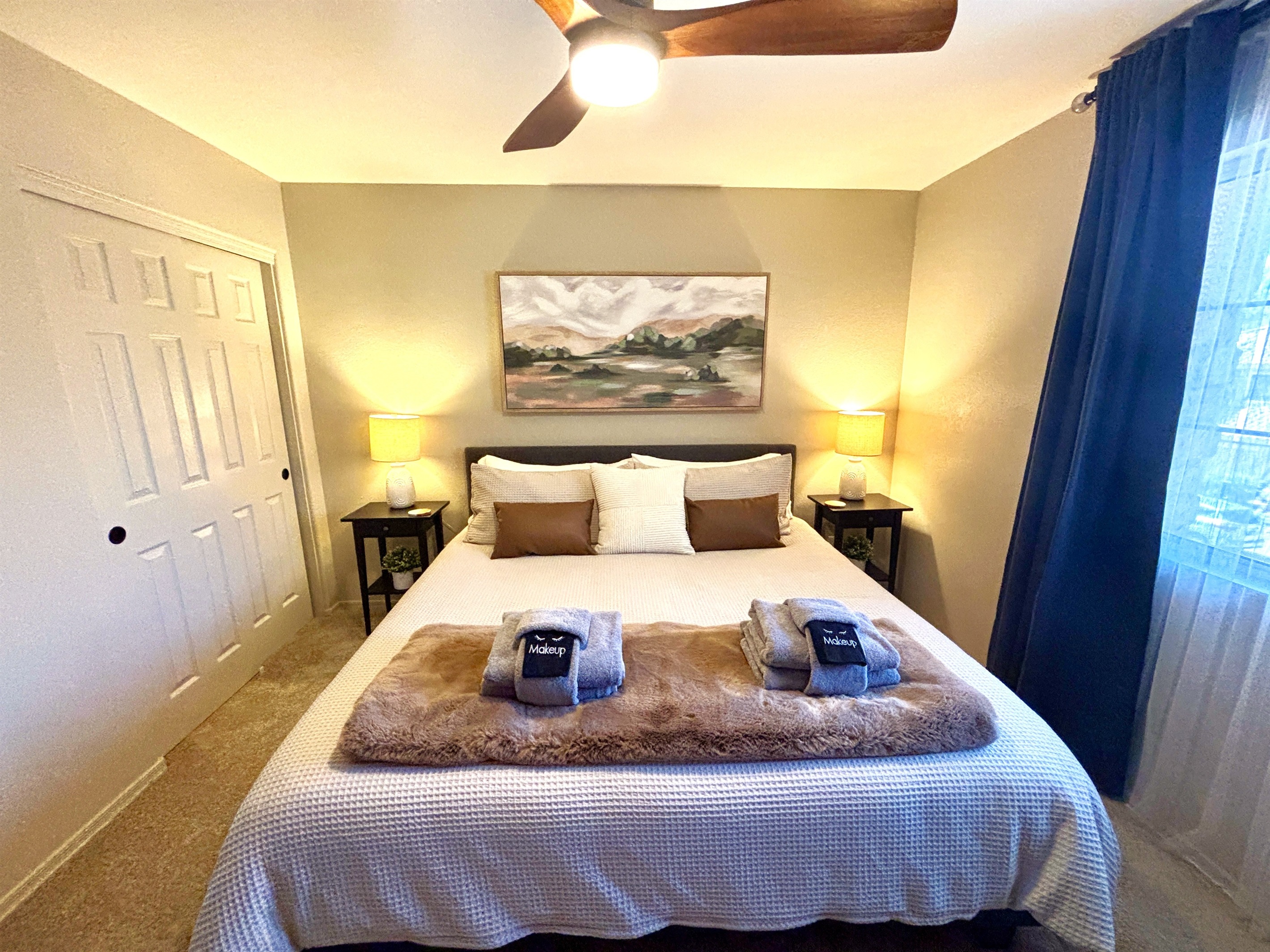 King bedroom upstairs with 55" Smart TV, Blackout curtains and ceiling fan