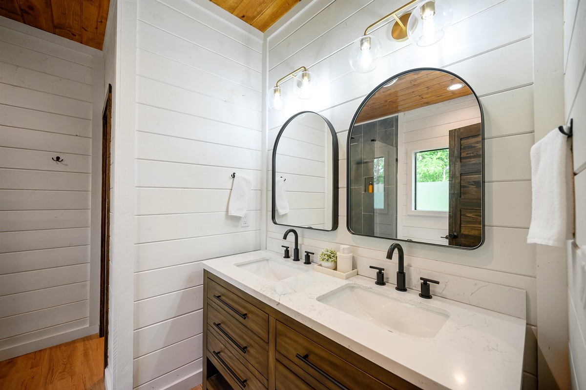 Modern and spacious with his-and-her sinks.