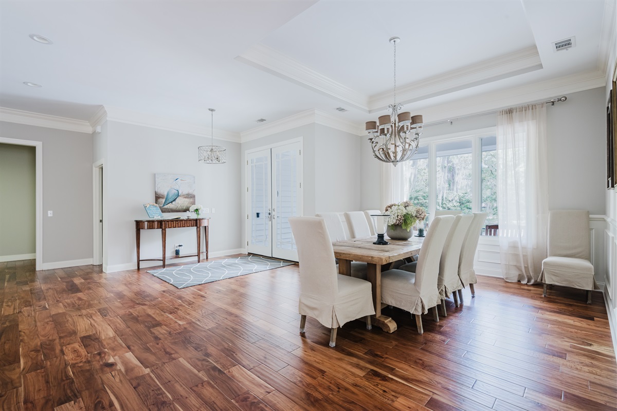 Bright and open entryway with large dining room to the right