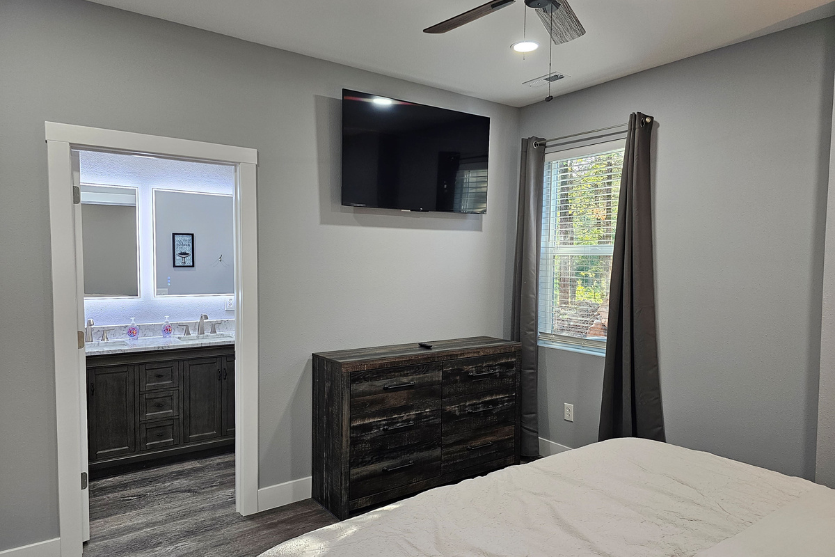Clean, modern King suite with smart TV.