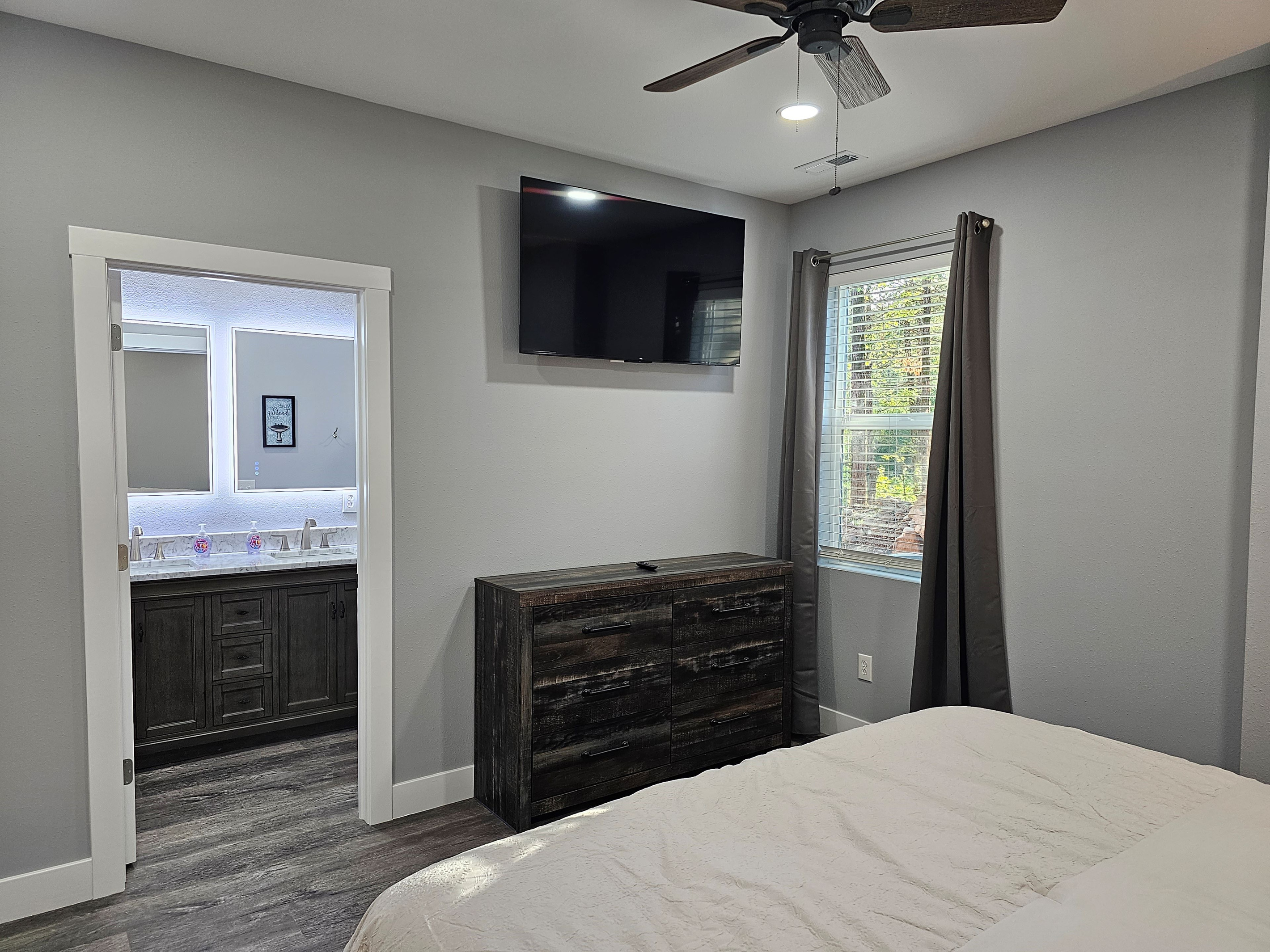Clean, modern King suite with smart TV.