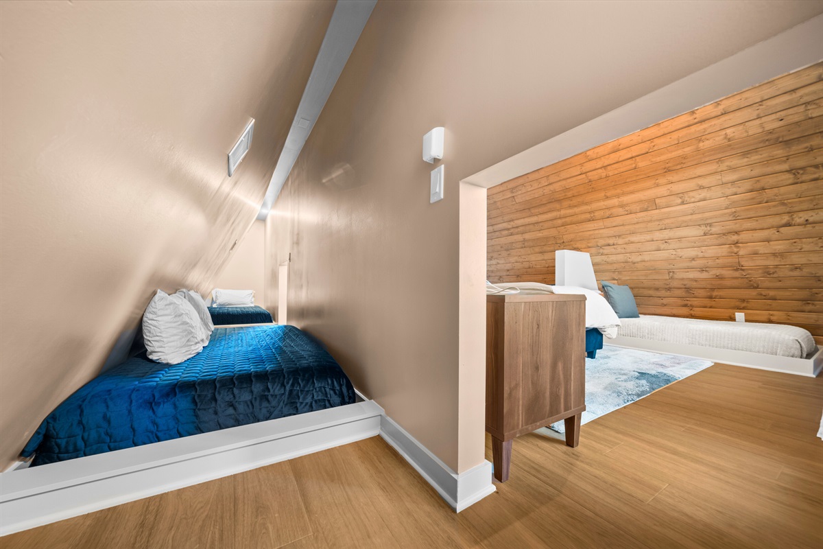 This loft-style space adds a fun touch, with the angled ceiling bringing in character and making it feel like a cozy little getaway nook.