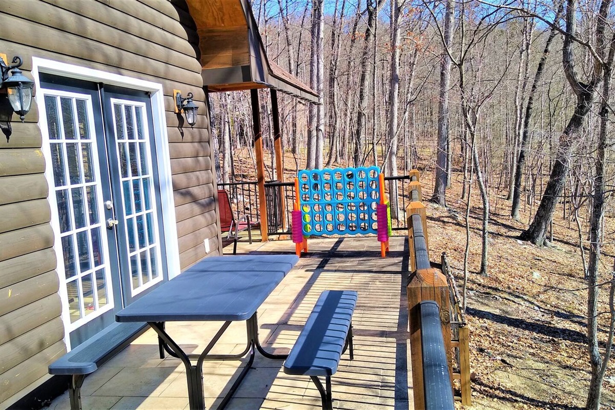 Wrap around balcony with picnic table, huge Connect-4 game and gas bbq grill.