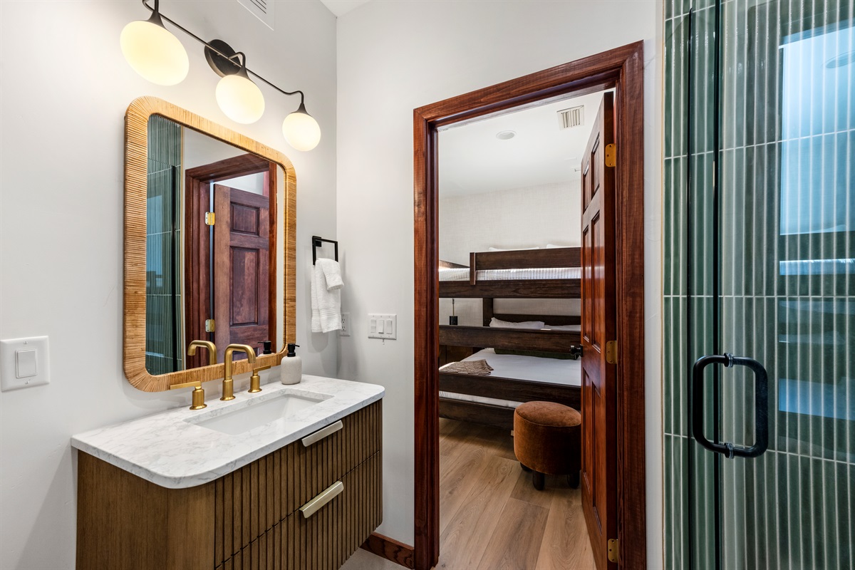 Thoughtfully designed bathroom with walk-in shower and modern touches.