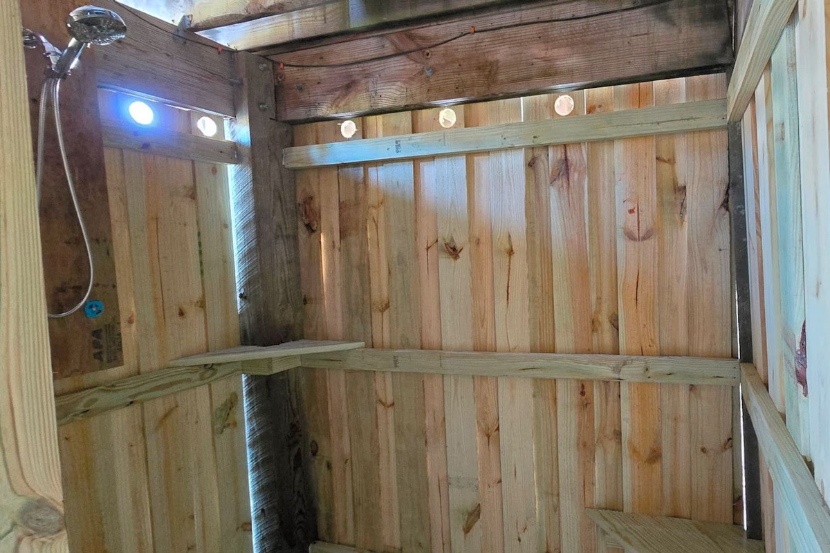 Step into the walk-in outdoor shower after a full beach day &mdash; hot water, fresh air, and you're ready for whatever's next.