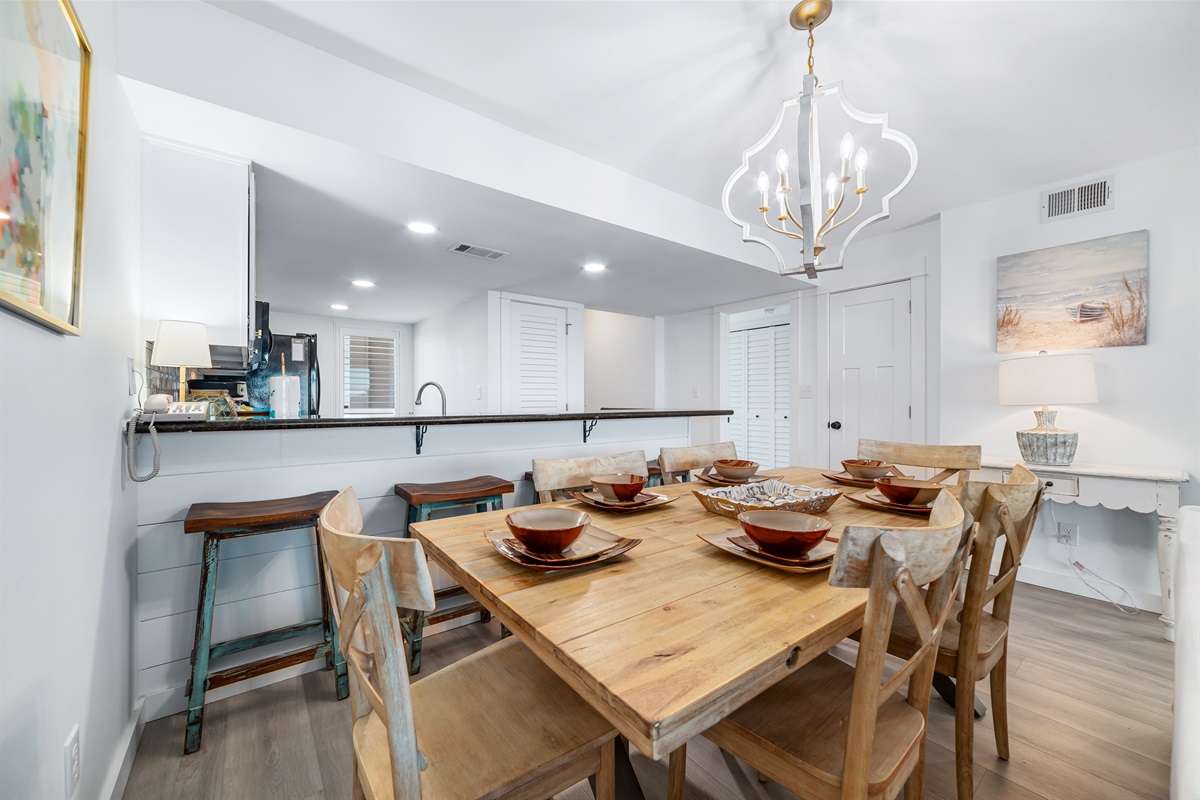 Flexible dining options for every occasion. Enjoy a formal meal at the dining table or a casual snack at the breakfast bar, seamlessly connected to the fully equipped kitchen.