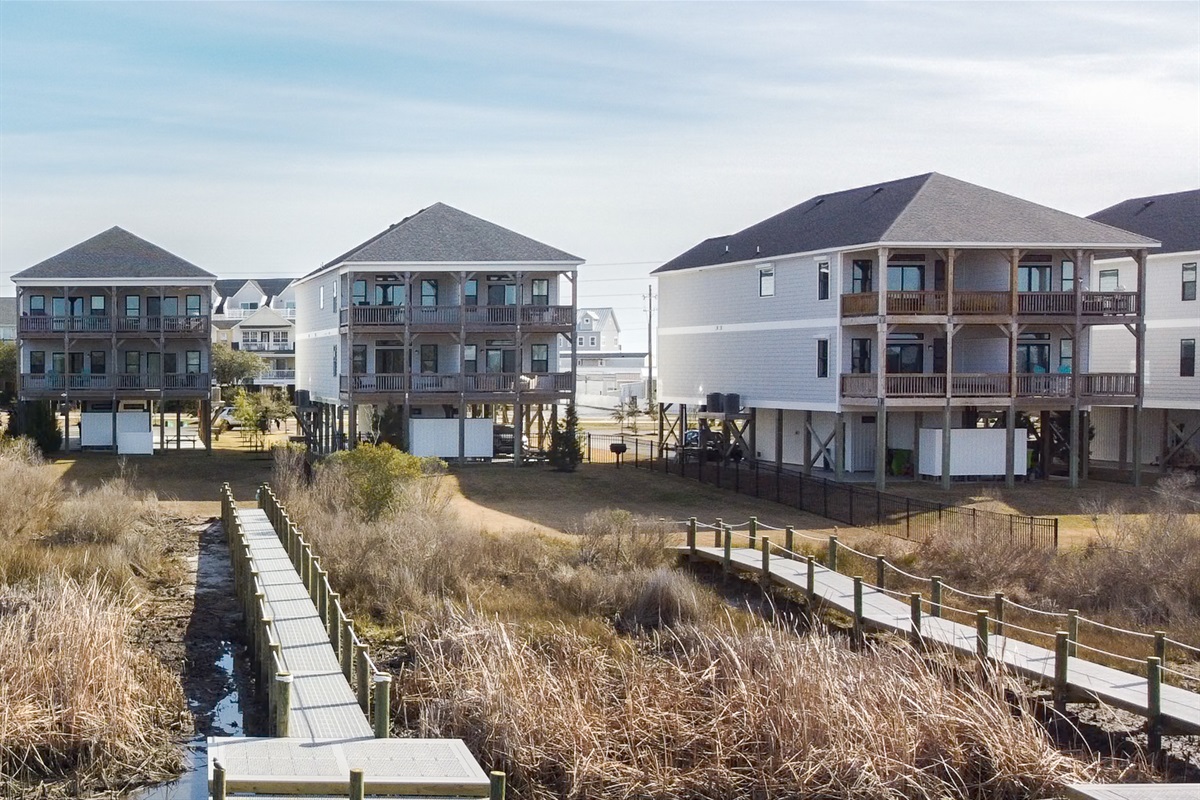 Soundfront setting with private docks, surrounded by calm waters and natural coastal scenery
