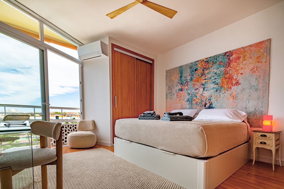 Main bedroom with sea views and private balcony access