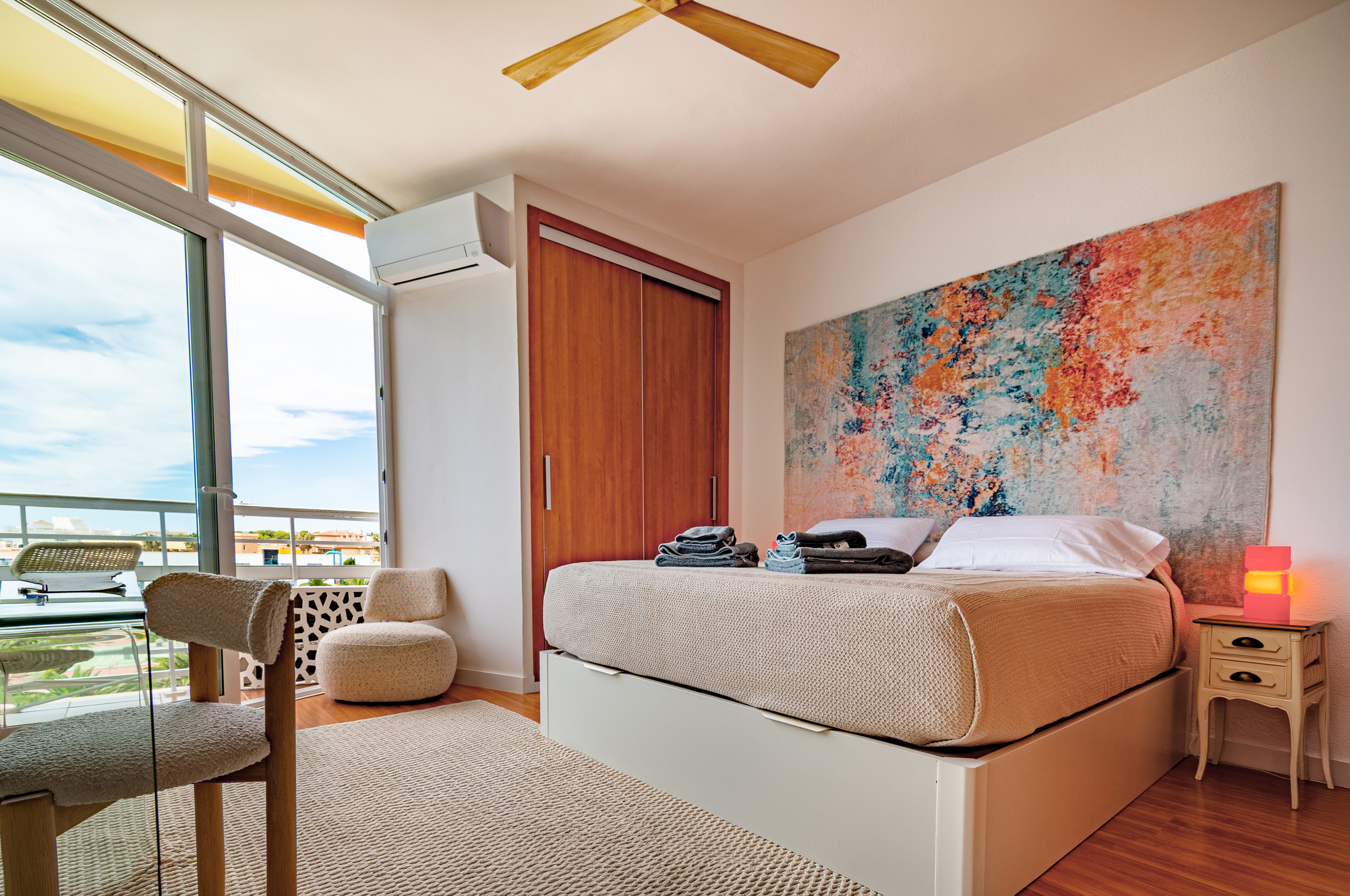 Main bedroom with sea views and private balcony access