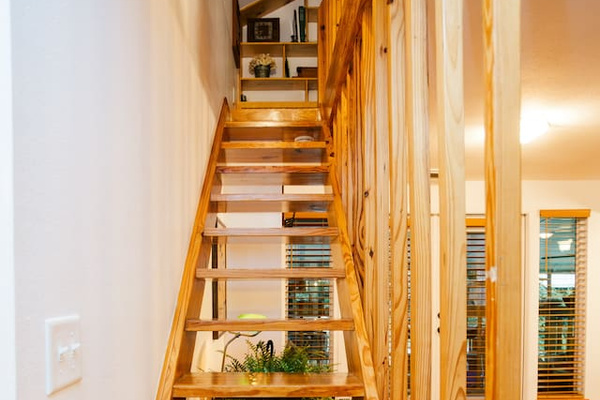 Pine stairway to the loft — steep and narrow, please use caution.