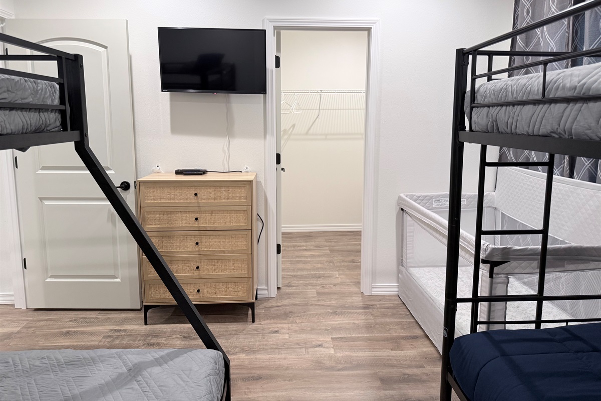 View from bunk bed area toward TV. Lots of floor space to move around.