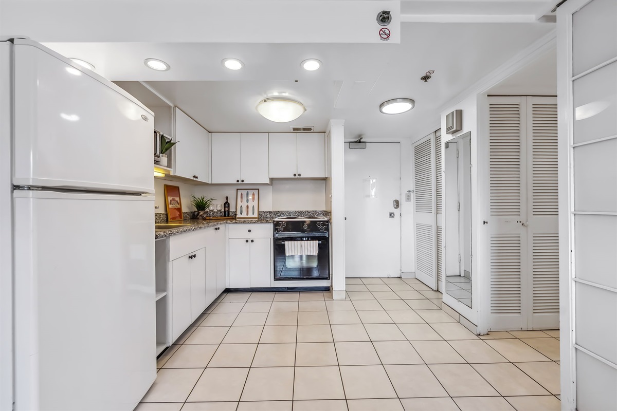 Kitchen is fully equipped with essentials for home cooking.  Full size refrigerator, stove/oven, microwave for guest convenience
